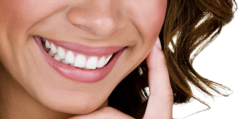 Closeup of a woman with perfect teeth smiling